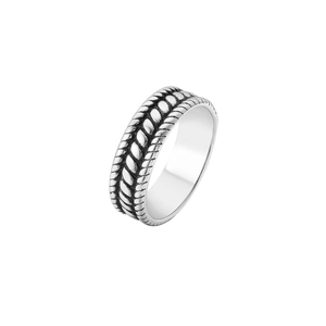 Detailed view of the twisted rope texture on a vintage silver titanium steel ring