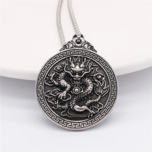 Vintage silver dragon relief pendant necklace with traditional cloud patterns
