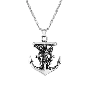 Macro detail of retro anchor and eagle pendant necklace in vintage stainless steel finish