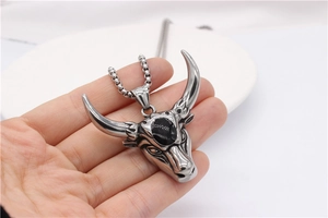 Detailed bull head pendant with black gemstone inlay and vintage stainless steel chain