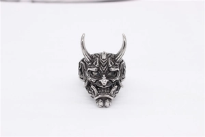Macro detail of retro Hannya skull mask ring in vintage silver finished stainless steel