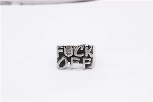 Macro detail of vintage punk style silver stainless steel ring with Fuck Off engraving