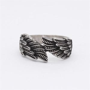 Vintage stainless steel angel wing open ring with detailed feather texture in silver finish