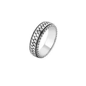 Macro shot of industrial retro titanium steel ring with wave texture and anti-slip edges