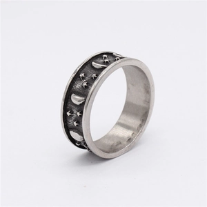 Retro stainless steel ring with embossed star and moon patterns in antique silver finish