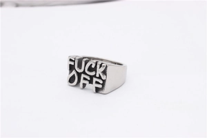 Detailed view of vintage silver steel ring with embossed fuck off punk design