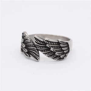 Retro stainless steel angel wing feather ring with vintage oxidized finish for unisex wear