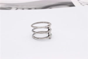 Detailed view of triple-layered silver titanium steel ring with industrial punk design