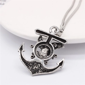 Vintage anchor and eagle titanium steel necklace with retro finish on white ceramic tray