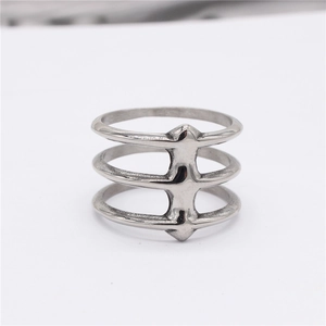 Minimalist triple-layer titanium steel ring featuring industrial hollow design on white background