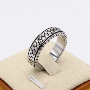 Retro titanium steel ring with textured chain relief pattern and polished inner finish