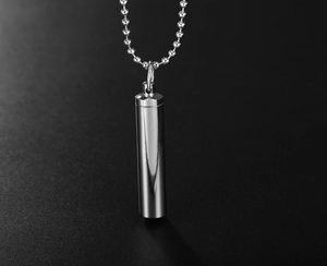 Polished stainless steel bullet-shaped perfume pendant shown on a bead chain necklace