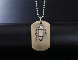 Detail of brushed metal army tag with bullet pendant and silver ball chain