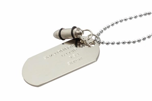 Detailed macro view of silver dog tag pendant and bullet charm on ball chain necklace
