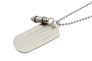Macro shot of stainless steel dog tag and bullet pendant with engraved personal details
