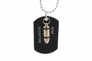 Detail of black dog tag with silver bullet pendant and bead chain for hip hop style