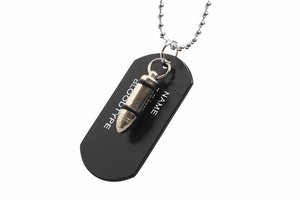 Detail of matte black dog tag and silver bullet pendant on stainless steel ball chain