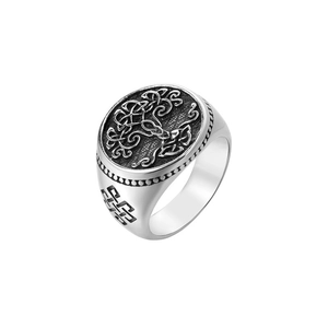 Detailed macro view of retro stainless steel ring with tree of life and celtic patterns