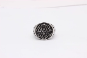 Detailed view of Celtic Tree of Life relief and oxidized finish on men's steel signet ring