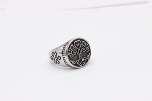 Detailed side view of the Celtic knot engraving on a vintage steel tree of life ring
