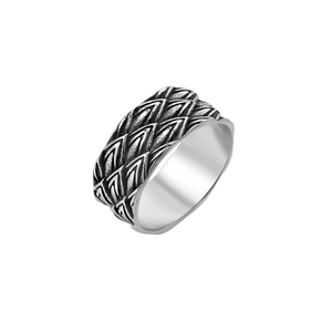 Macro detail of vintage dragon scale texture on retro titanium steel ring for men