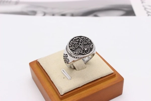 Macro view of vintage tree of life signet ring with Celtic knot patterns on the side