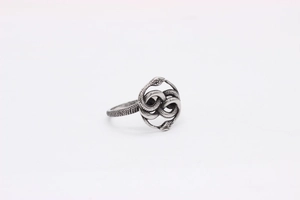 Detail of vintage double snake ring with intricate scales and antique silver finish