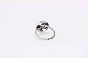 Macro view of vintage silver snake ring with textured band and retro oxidized finish