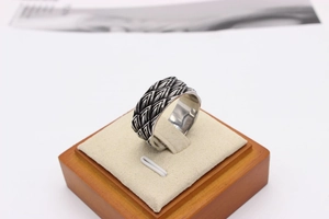 Detailed close-up of retro dragon scale texture on a men's vintage titanium steel ring