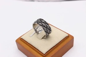 Detailed view of vintage silver steel ring with gothic dragon scale texture on cushion