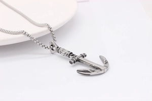 Close-up of vintage anchor pendant with antique silver finish on a steel box chain