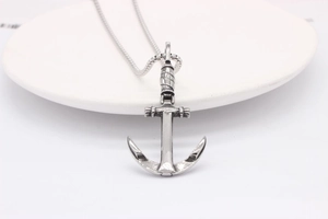 Detailed shot of retro anchor pendant with rope texture on snake chain necklace