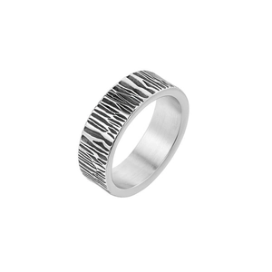 Detailed close-up of retro stainless steel ring featuring textured bark pattern