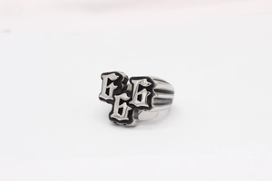 Close-up of vintage gothic 666 stainless steel ring with black oil finish and ribbed band