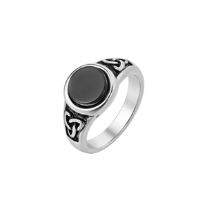 Detailed view of Viking steel ring with black stone and Celtic knot relief patterns