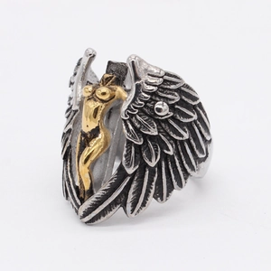 Gothic retro stainless steel ring with golden angel relief and large silver feather wings