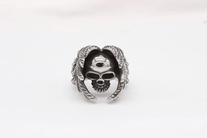 Detail view of gothic skull ring with wing relief in vintage stainless steel