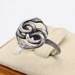 Vintage silver snake ring featuring double intertwined serpents with scale textures