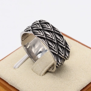Retro dragon scale stainless steel ring for men with vintage silver finish on display