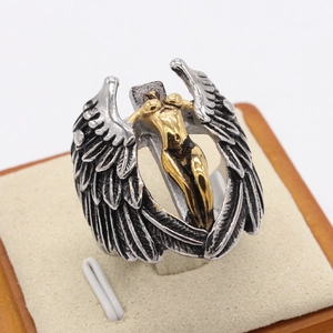 Vintage silver wings ring with a golden female sculpture and gothic art design
