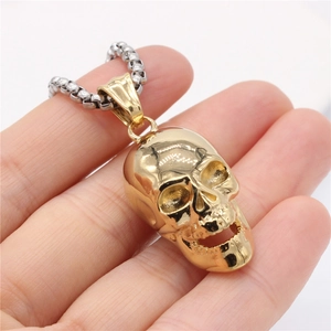 Retro golden skull pendant necklace with silver chain for men in vintage steel style