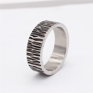 Vintage industrial style titanium steel ring with textured vertical bark pattern