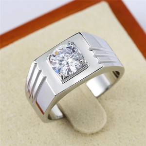 Men's silver wedding ring with round cubic zirconia center stone on velvet stand