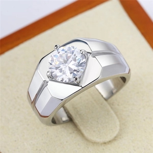 Macro shot of men's silver ring with a large round cubic zirconia in a wide band