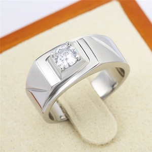Minimalist silver men's wedding ring with polished finish and central round cubic zirconia