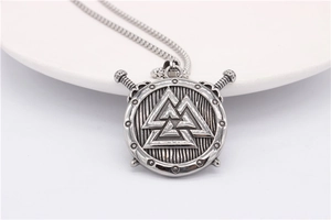 Detail of Viking Valknut shield pendant with crossed swords on steel box chain