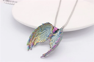 Detailed view of iridescent fallen angel wing pendant with detailed feather texture