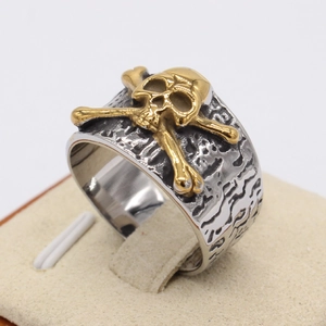 Retro punk silver stainless steel ring with 3D gold skull and crossbones emblem