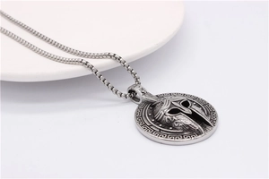 Detail view of retro Spartan helmet pendant with Greek key border and box chain