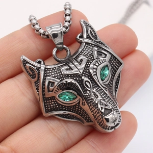 Vintage steel wolf head pendant necklace with green crystal eyes on a box chain